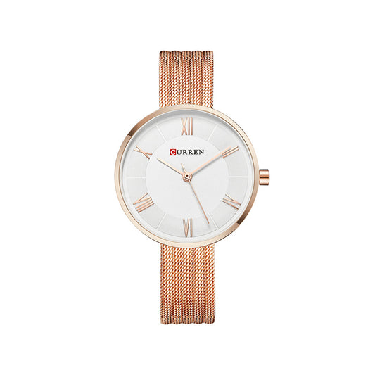 Rose gold watch with white dial on a white background

